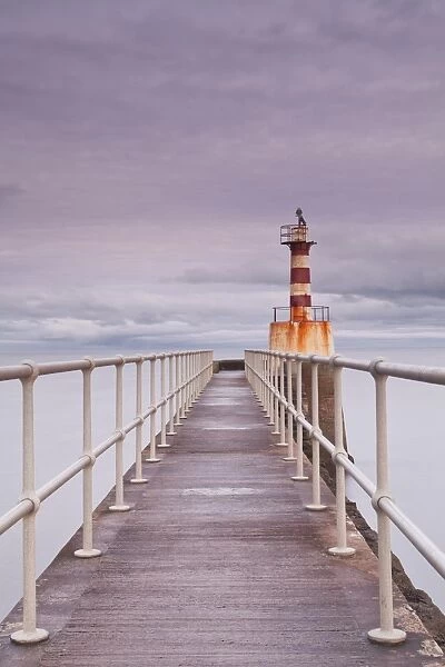 The South Jetty lighthouse in Amble on the Northumberland coastline, Northumberland, England, United Kingdom, Europe