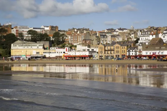 Framed Print : South Sands in South Bay at low tide with seafront buildings reflected in wet sand on beach Framed Print : South Sands in South Bay at low tide with seafront buildings reflected in wet sand on beach