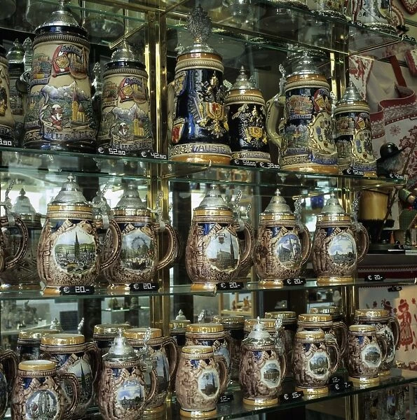 Souvenir shop window display of traditional Austrian beer tankards, Vienna, Austria, Europe