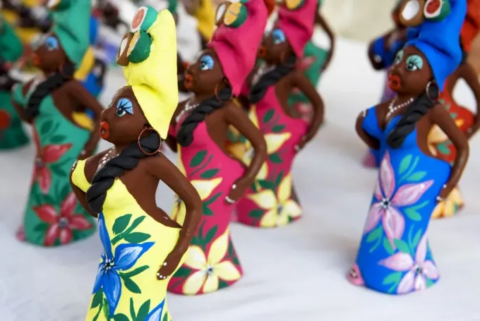 Framed Print : Souvenir traditional Cuban lady statues for sale in craft market in Trinidad