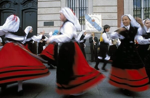 Spaniards in national dress performing outdoors at