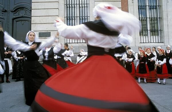 Spaniards in national dress performing outdoors at