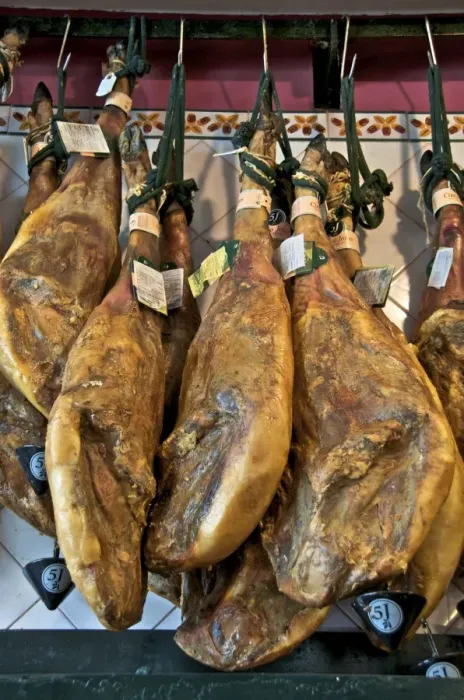 Framed Print : Spanish hams hanging in a restaurant bodega, Seville, Andalusia, Spain, Europe