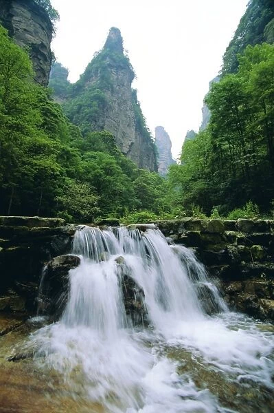 Spectacular limestone outcrops, forests and waterfalls of Zhangjiajie Forest Park in the Wulingyuan Scenic Area, Hunan
