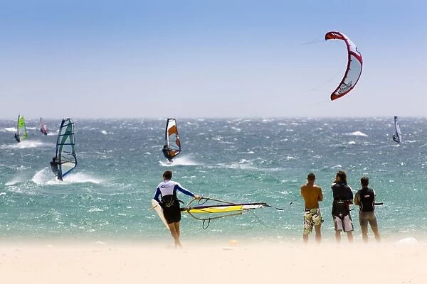 Spectators watching windsurfing in high Levante winds in the Strait of Gibraltar, Valdevaqueros, Tarifa, Andalucia, Spain, Europe