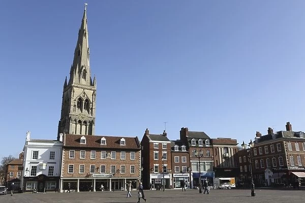 The spire of St. Mary Magdalene church rises over building on the Market Square in
