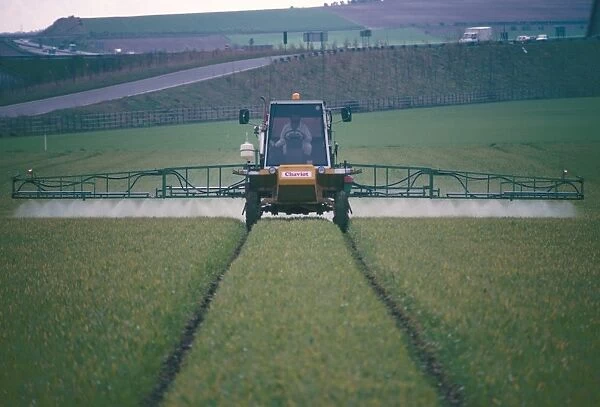 Spraying pesticides on crops in fields, Cambridgeshire, England, United Kingdom, Europe