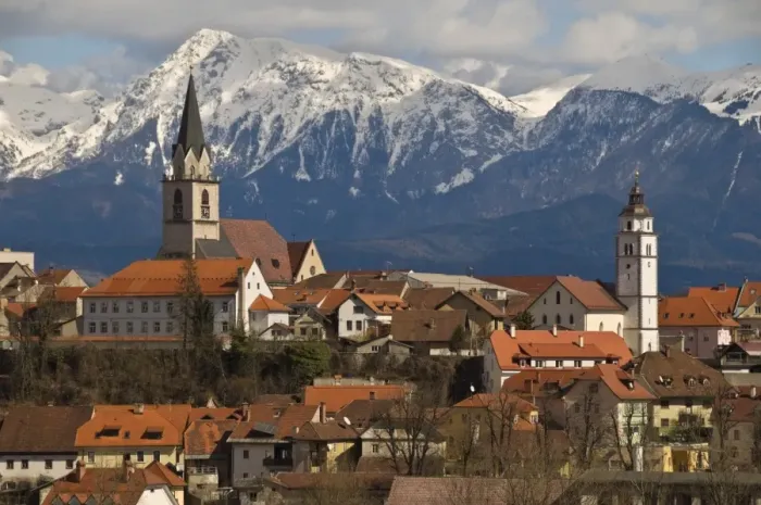 Framed Print : St. Cantianus Church in the foreground and the Kamnik Alps behind, Kranj Framed Print : St. Cantianus Church in the foreground and the Kamnik Alps behind, Kranj