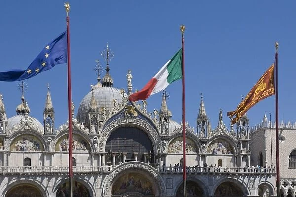 St. Marks with the flags of the EU, Italy, and the Venice Lion, St. Marks Square