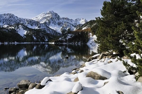 St. Maurici Lake and snowy peaks of Aigues Tortes National Park in winter, Pyrenees, Catalonia, Spain, Europe