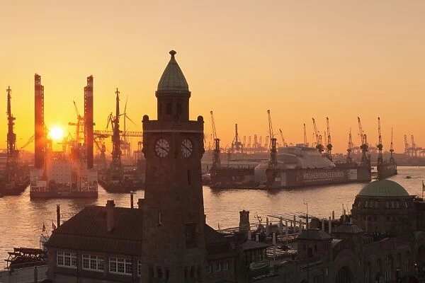 St. Pauli Landungsbruecken pier against harbour at sunset, Hamburg, Hanseatic City