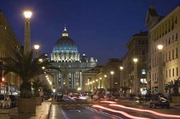 St. Peters Basilica illuminated at night with moving traffic, Vatican City