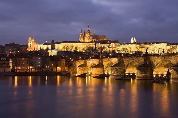 St. Vitus Cathedral, Charles Bridge and the Castle District illuminated at night in winter