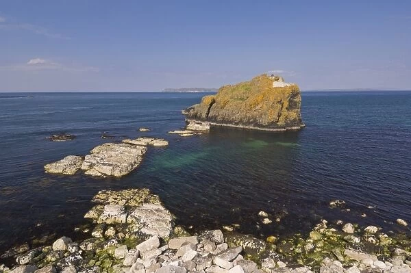 Stackaboy Island in Larrybane Bay with Rathlin Island in the background
