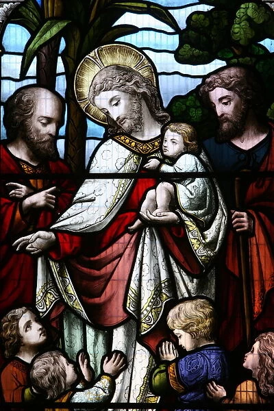 Stained glass window depicting Jesus welcoming children, Billingshurst, Sussex, England