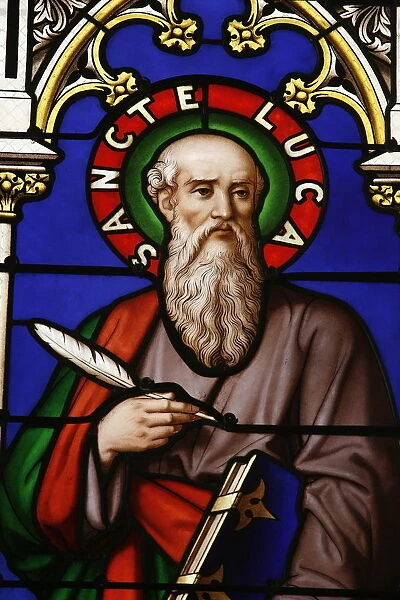 Stained glass window of St. Luke at Collegiale Notre-Dame des Marais
