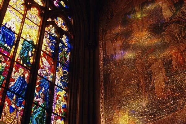Stained glass window throwing light on fresco, St. Vitus Cathedral, Hradcany