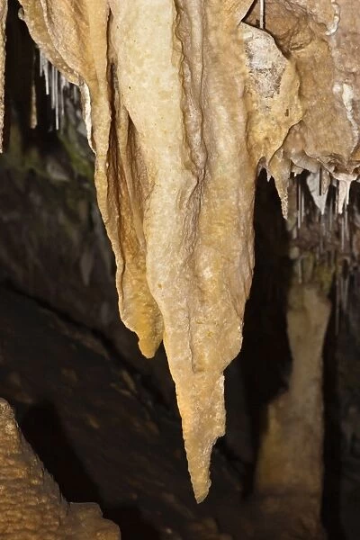Stalactites with drapery and straws at Ngilgi Cave, a limestone Karst cave system near Yallingup in the South West, Augusta-Margaret River Shire, Western Australia