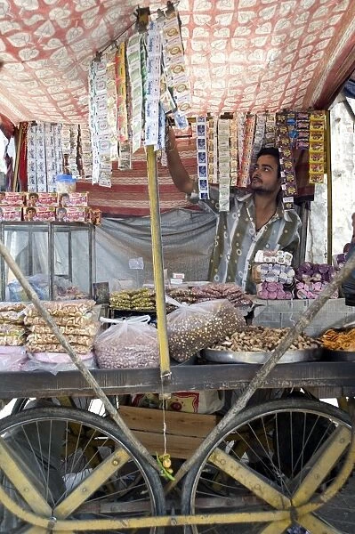 Stall holder selling gutka, namkeen snacks and bidi cigarettes, Kishangarh