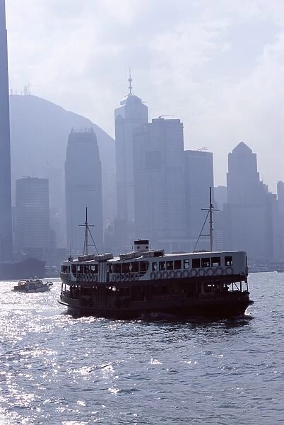 Star Ferry, Victoria Harbour, with Hong Kong Island skyline in mist beyond