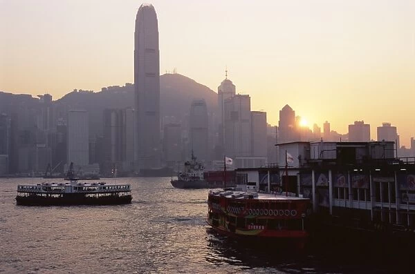 Star Ferry, Victoria Harbour and skyline of Hong Kong Island at sunset