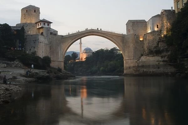 Stari Most Peace Bridge and reflection of mosque on Neretva River, Mostar