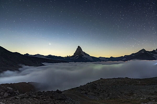 Starry night over Matterhorn in the mist, Zermatt, Valais Canton, Swiss Alps, Switzerland