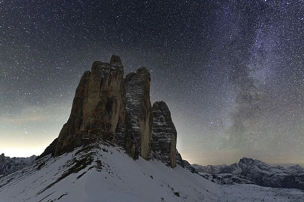 Stars in the night sky over the majestic rocks of Tre Cime di Lavaredo, Sesto Dolomites