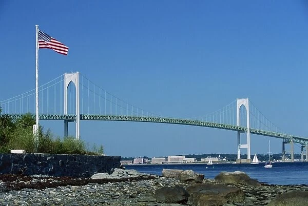 The Stars and Stripes flying before the Newport Bridge