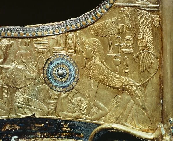 Detail from a state chariot showing the king as a sphinx trampling the enemies of Egypt underfoot
