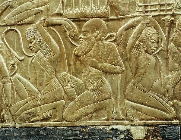 Detail from a state chariot showing the vanquished and enslaved enemies of Egypt