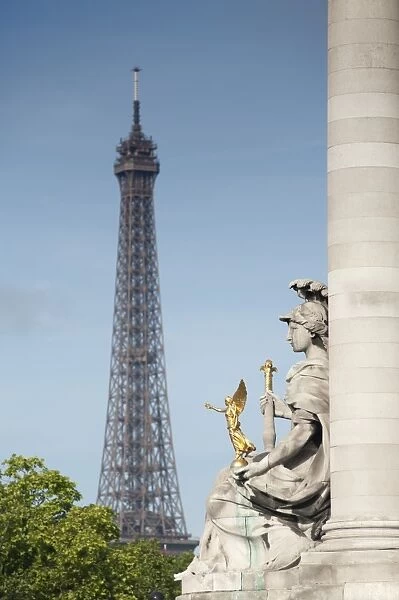Statue on the Alexandre III Bridge and the Eiffel Tower, Paris, France, Europe
