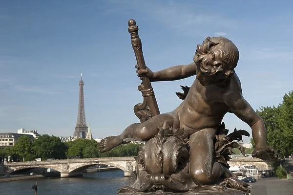 Statue on the Alexandre III Bridge, River Seine and the Eiffel Tower, Paris, France, Europe