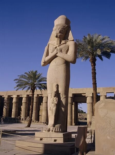 Statue of Amun, with Ramses II (Ramasses the Great) between his knees, Karnak
