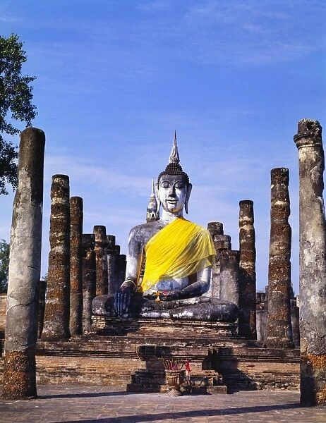 Statue of the Buddha With Religious Offerings, Wat Mahathat, Sukothai, Thailand