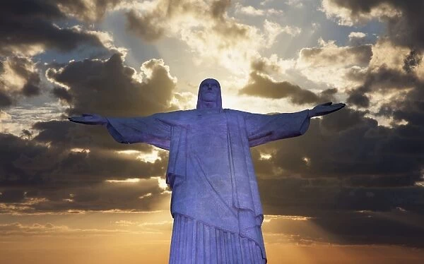 Statue of Christ the Redeemer at sunset, Corcovado, Rio de Janeiro, Brazil, South America