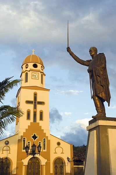 Statue and church in town square, Salento, Colombia, South America