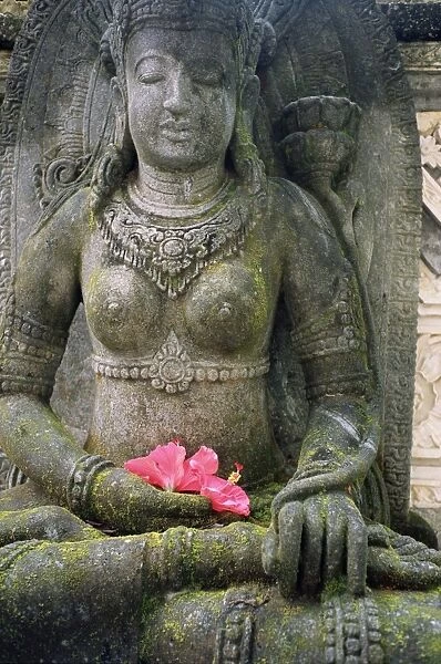 Statue with flower offering