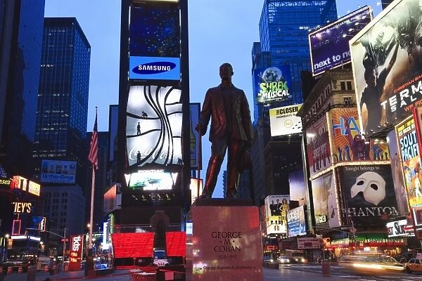 Statue of George M. Cohan, composer of Give My Regards to Broadway, Times Square at dusk
