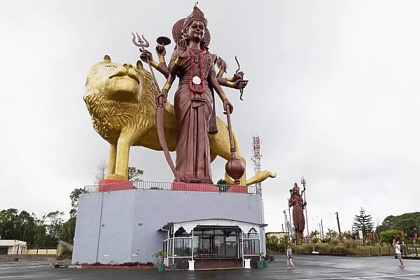 Statue of the Hindu goddess Durga, 108 feet tall, with her lion vehicle Manastala, at Ganga Talao, Mauritius, Indian Ocean, Africa