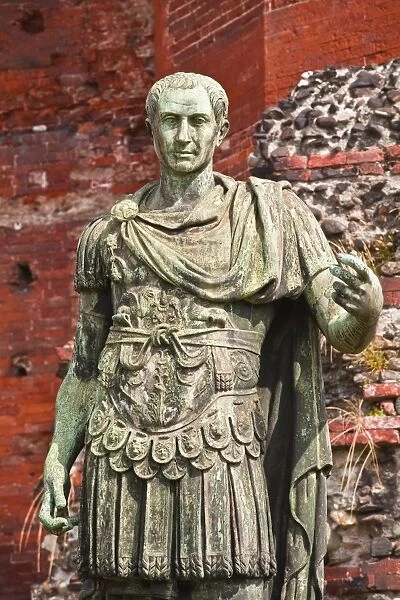 A statue of Julius Cesar in front of Porta Palatina, Turin, Piedmont, Italy, Europe