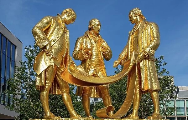 The statue of Matthew Boulton, James Watt and William Murdoch known as The Golden Boys, Centenary Square, Birmingham, West Midlands, England, United Kingdom, Europe