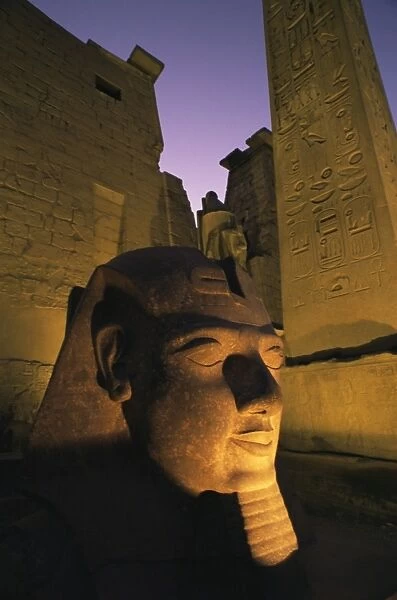Statue of the pharaoh Ramses II at entrance to the Temple of Luxor, Thebes