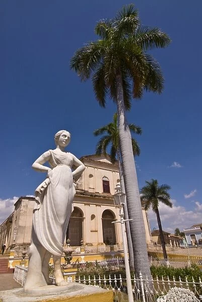 Statue in front of the Plaza Mayor with Iglesia Parroquial de la Santisima Trinidad