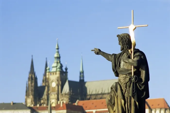 Framed Print : Statue of St. John the Baptist, dating from 1857, on Charles Bridge, pointing to Gothic St Framed Print : Statue of St. John the Baptist, dating from 1857, on Charles Bridge, pointing to Gothic St
