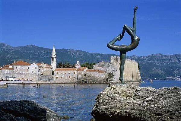 Statue and view of Old Town, Budva, The Budva Riviera, Montenegro, Europe