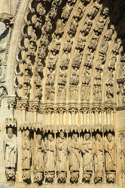 Statues of apostles and prophets in the splay and the left sidewall of the central portal