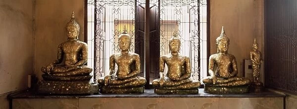 Statues of the Buddha covered in gold leaf