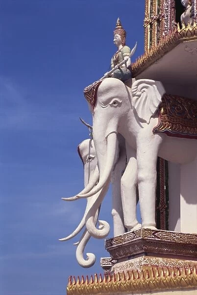 Statues of elephants and rider on the temple at Wat Tham Sua near Kanchanaburi