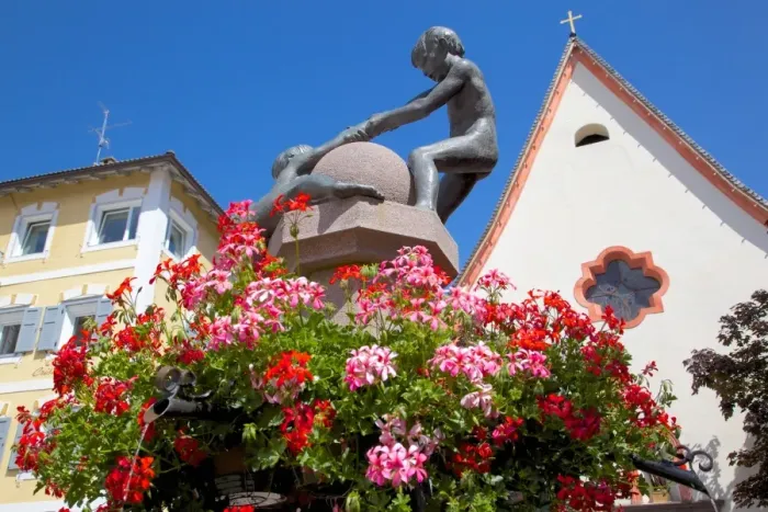 Framed Print : Statues and geraniums in Town Square, Ortisei, Gardena Valley, Bolzano Province, Trentino-Alto Adige / South Tyrol, Italian Dolomites, Italy, Europe Framed Print : Statues and geraniums in Town Square, Ortisei, Gardena Valley, Bolzano Province, Trentino-Alto Adige / South Tyrol, Italian Dolomites, Italy, Europe
